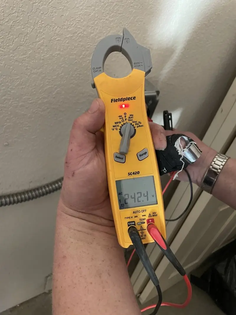 Voltage testing with clamp meter during Electrical Installation Services in Harpswell
